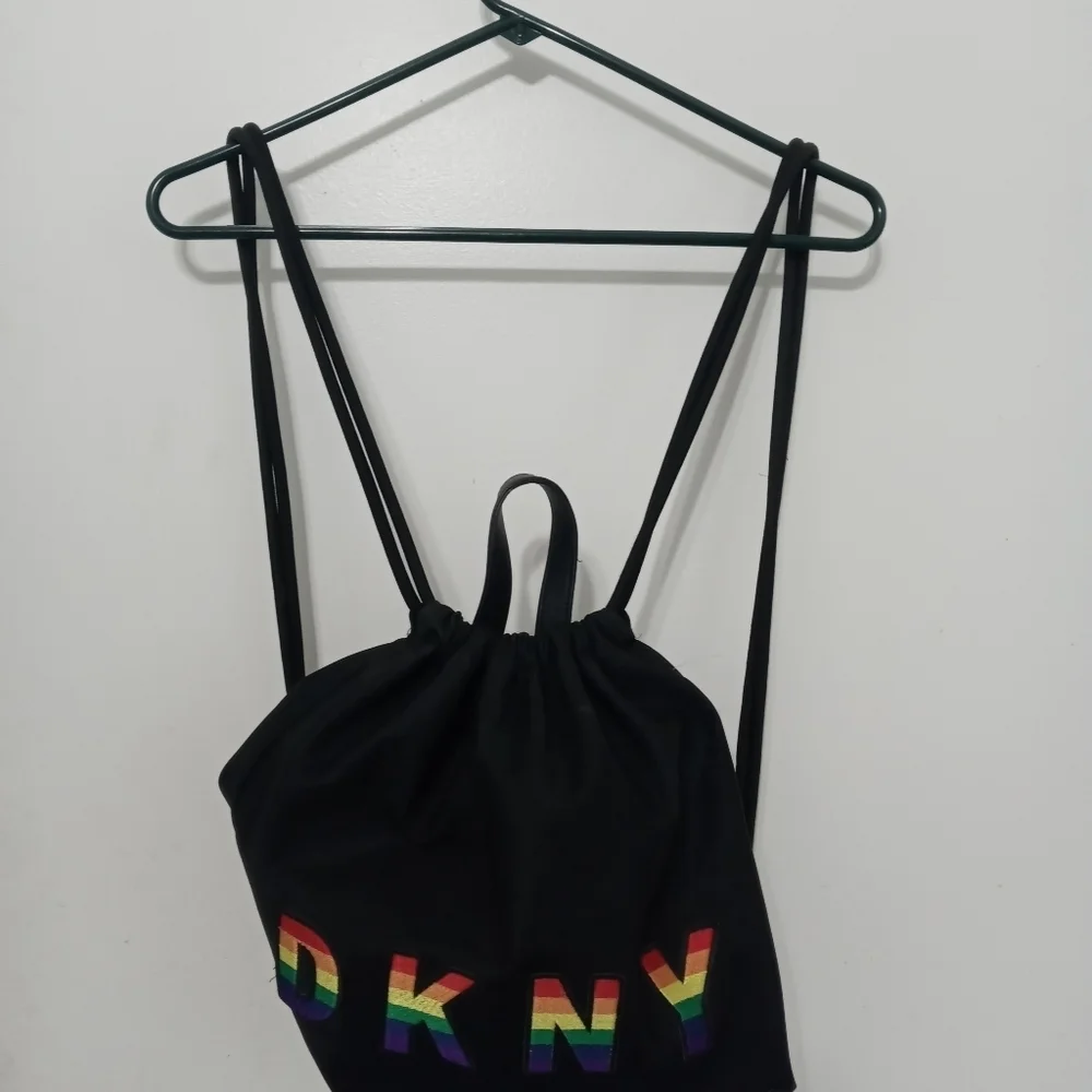 DKNY RAISED RAINBOW LETTER HEAVYWEIGHT DRAWSTRING BACPACK W MULTIPLE POCKETS